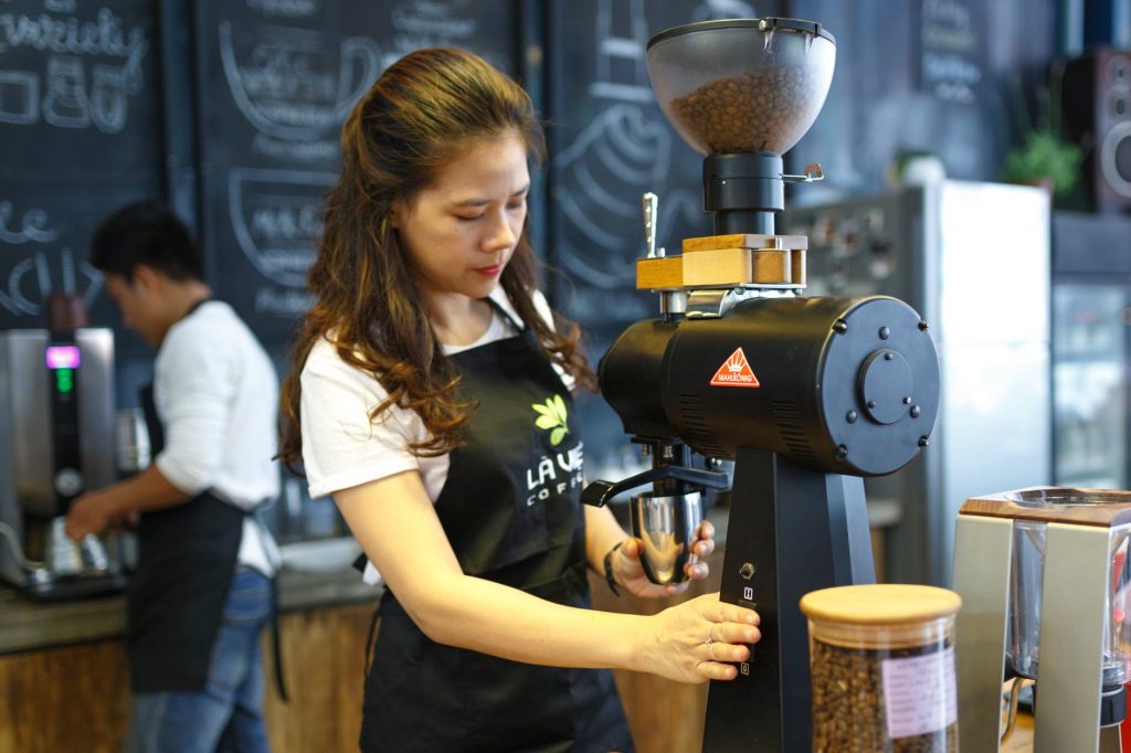 Grinding coffee beans with a coffee grinder